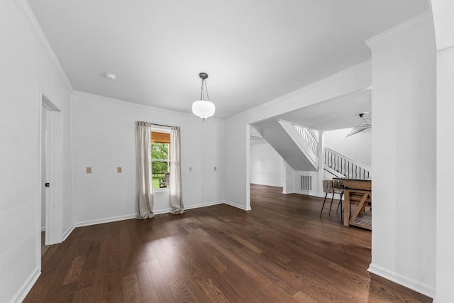 unfurnished dining area featuring stairway, wood finished floors, ornamental molding, and baseboards
