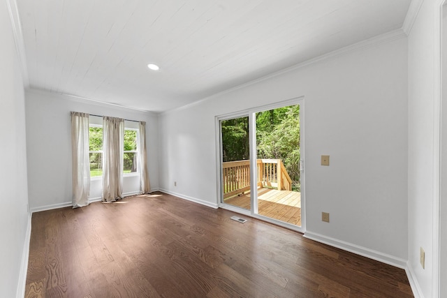 spare room featuring ornamental molding, dark wood finished floors, baseboards, and recessed lighting