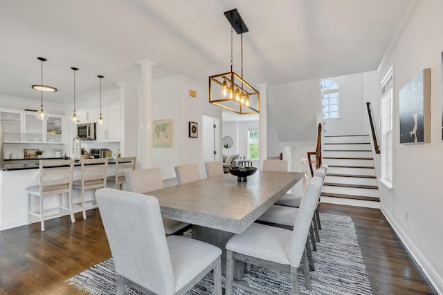 1206 Forest Lake Ct, Franklin, TN 37064 - dining room featuring dark wood-style floors, stairs, and crown molding