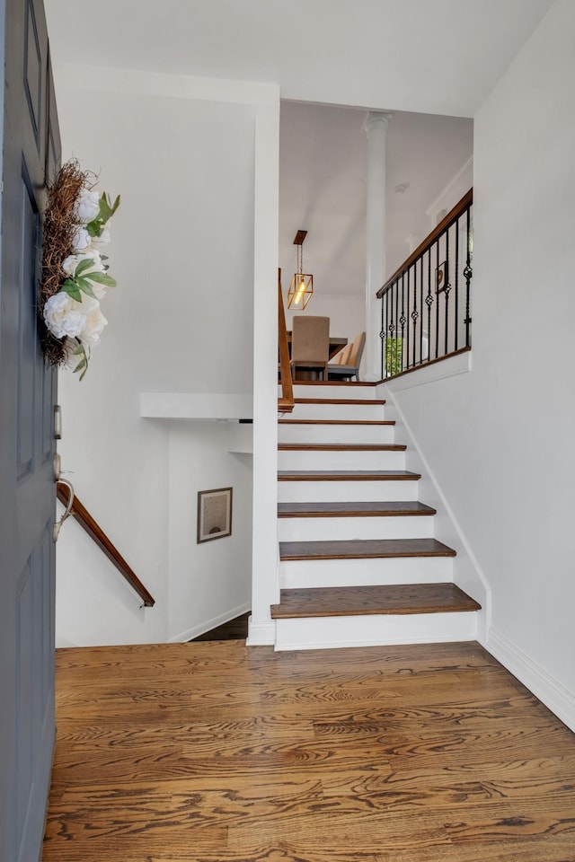 1206 Forest Lake Ct, Franklin, TN 37064 - staircase featuring wood finished floors, decorative columns, and baseboards