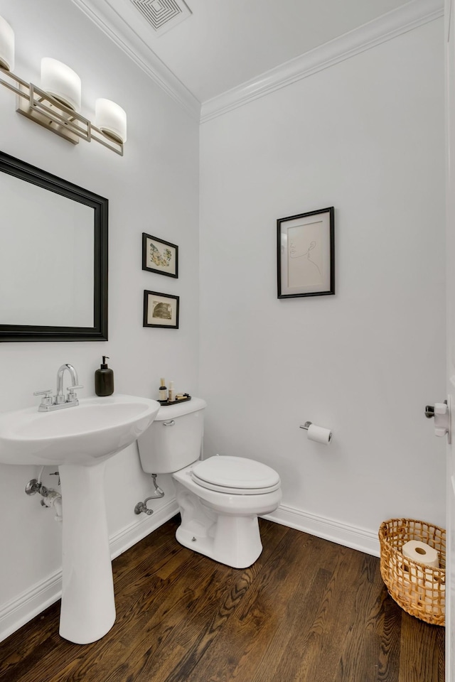 1206 Forest Lake Ct, Franklin, TN 37064 - bathroom with baseboards, toilet, ornamental molding, and wood finished floors