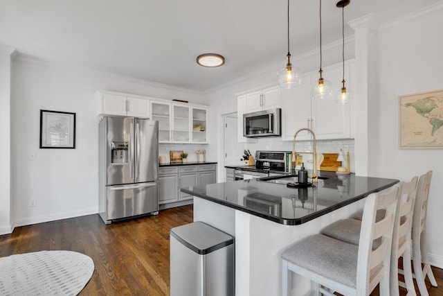 1206 Forest Lake Ct, Franklin, TN 37064 - kitchen with appliances with stainless steel finishes, a sink, a peninsula, decorative backsplash, and white cabinetry