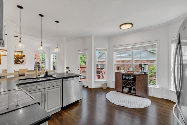 1206 Forest Lake Ct, Franklin, TN 37064 - kitchen with a sink, stainless steel appliances, dark countertops, dark wood finished floors, and pendant lighting