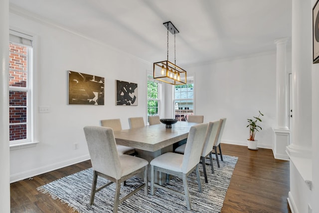 1206 Forest Lake Ct, Franklin, TN 37064 - dining room with ornate columns, dark wood-style flooring, crown molding, baseboards, and a chandelier
