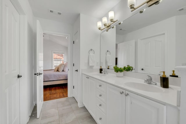 1206 Forest Lake Ct, Franklin, TN 37064 - bathroom with lofted ceiling, double vanity, and ensuite bath