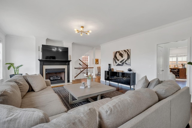 1206 Forest Lake Ct, Franklin, TN 37064 - living area featuring a chandelier, crown molding, a fireplace, stairs, and wood finished floors