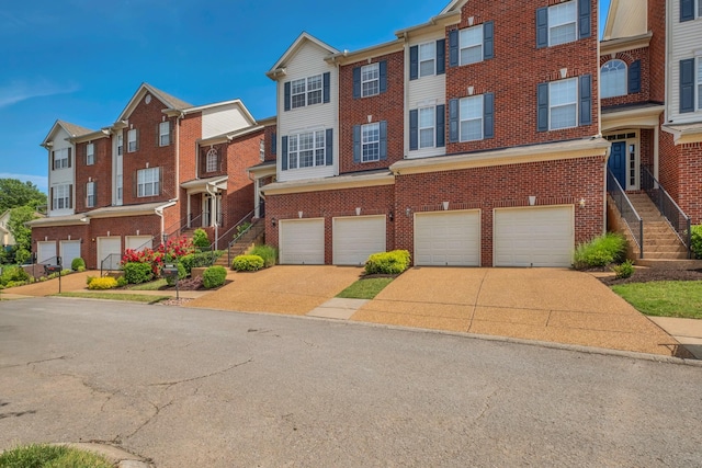 1206 Forest Lake Ct, Franklin, TN 37064 - townhome / multi-family property featuring brick siding, an attached garage, and concrete driveway