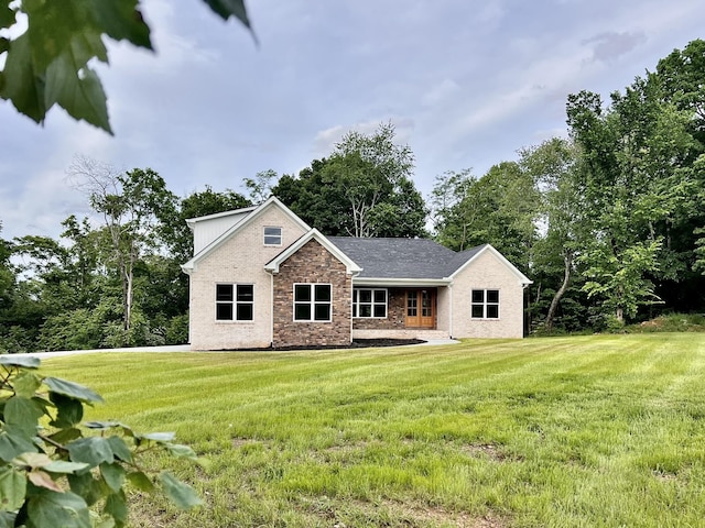 501 Chestnut Grove Rd, Pulaski, TN 38478 - back of house featuring a lawn and stone siding