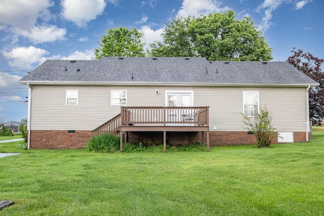 rear view of property with crawl space, a wooden deck, a yard, and a shingled roof