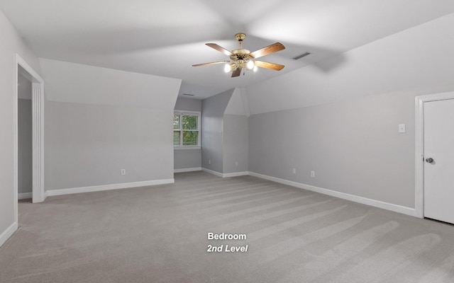 bonus room with a ceiling fan, carpet floors, vaulted ceiling, and baseboards