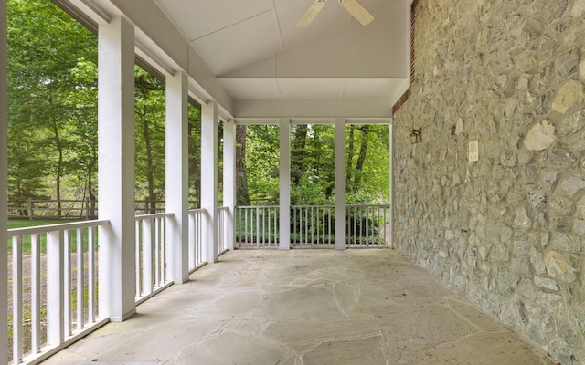 unfurnished sunroom with vaulted ceiling