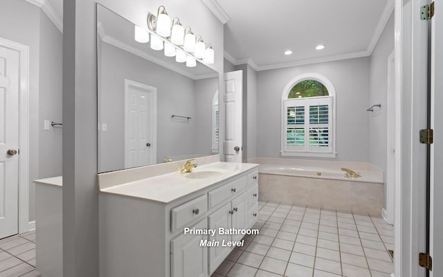 bathroom with tile patterned floors, ornamental molding, vanity, a garden tub, and recessed lighting