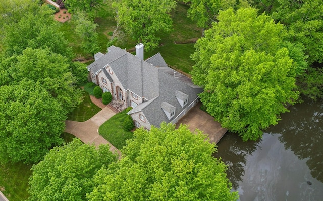 aerial view of property and surrounding area featuring a large body of water