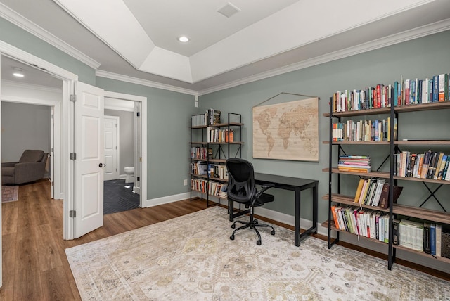 office area featuring wood finished floors, crown molding, baseboards, a tray ceiling, and recessed lighting