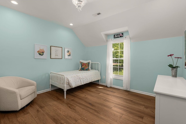 bedroom with lofted ceiling, wood finished floors, baseboards, recessed lighting, and a chandelier