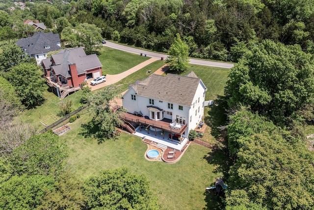 view from above of property featuring a heavily wooded area