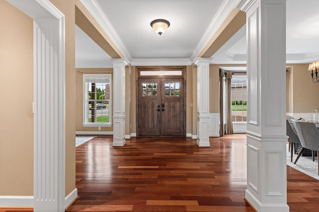 1115 Rossifer Ct, Gallatin, TN 37066 - foyer entrance with decorative columns, crown molding, dark wood-style floors, and a chandelier