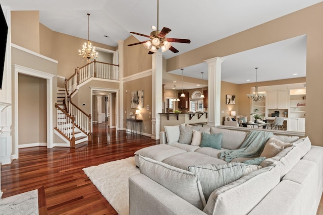1115 Rossifer Ct, Gallatin, TN 37066 - living area with stairs, a chandelier, a ceiling fan, wood finished floors, and baseboards