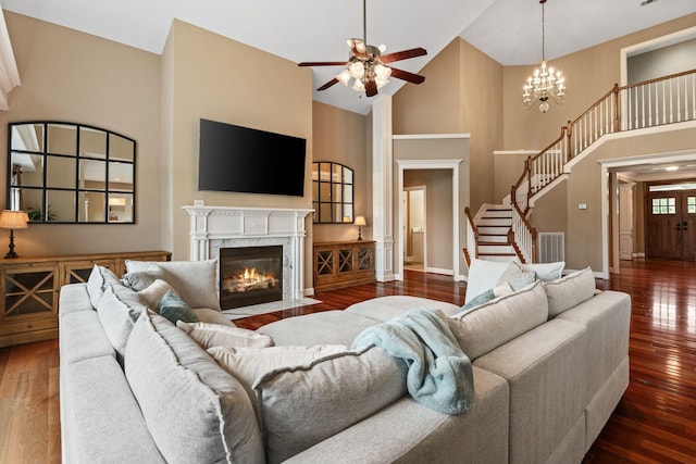 1115 Rossifer Ct, Gallatin, TN 37066 - living area featuring high vaulted ceiling, a ceiling fan, hardwood / wood-style flooring, stairway, and baseboards