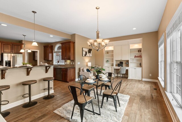 1115 Rossifer Ct, Gallatin, TN 37066 - dining room with a chandelier, light wood-style floors, baseboards, and recessed lighting