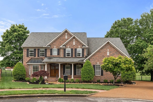 1115 Rossifer Ct, Gallatin, TN 37066 - view of front of home with brick siding, roof with shingles, and a porch