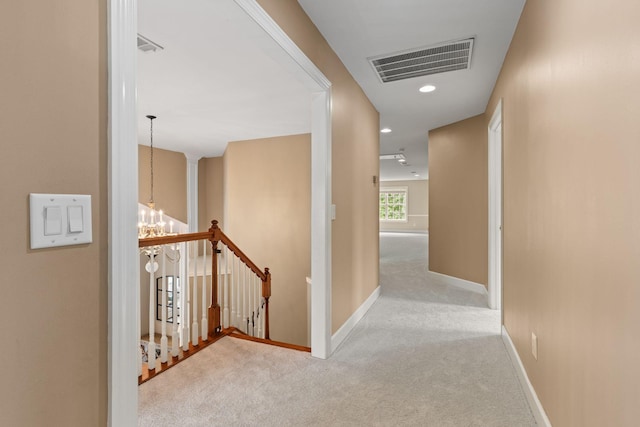 1115 Rossifer Ct, Gallatin, TN 37066 - hallway with an upstairs landing, carpet floors, a chandelier, baseboards, and recessed lighting