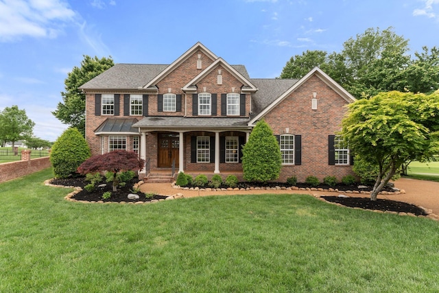 1115 Rossifer Ct, Gallatin, TN 37066 - view of front facade with brick siding, covered porch, and roof with shingles