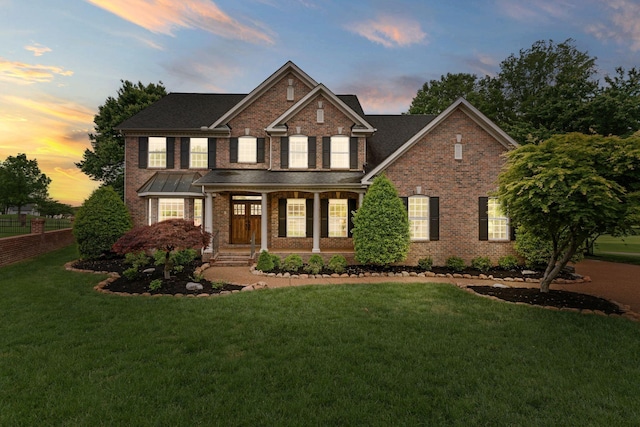 1115 Rossifer Ct, Gallatin, TN 37066 - view of front of home featuring brick siding, a front yard, and a porch