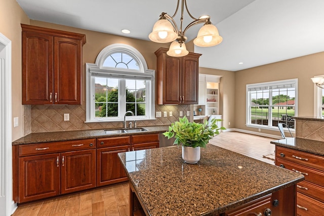1115 Rossifer Ct, Gallatin, TN 37066 - kitchen with a sink, light wood finished floors, healthy amount of natural light, decorative backsplash, and recessed lighting