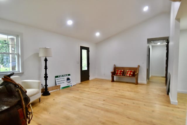 sitting room featuring vaulted ceiling, light wood-style flooring, recessed lighting, and baseboards