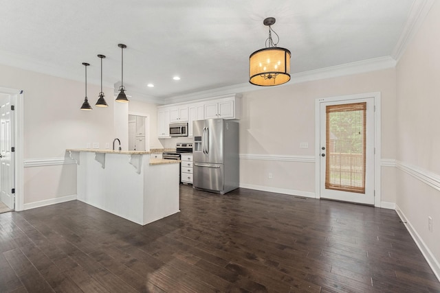 1165 Short Springs Rd, Tullahoma, TN 37388 - kitchen with stainless steel appliances, a peninsula, a kitchen bar, crown molding, and light stone counters