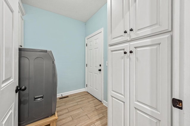 1165 Short Springs Rd, Tullahoma, TN 37388 - interior space featuring cabinet space, light wood-style flooring, baseboards, and a textured ceiling