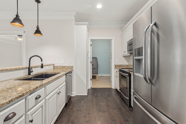 1165 Short Springs Rd, Tullahoma, TN 37388 - kitchen with appliances with stainless steel finishes, a sink, crown molding, white cabinetry, and light stone countertops