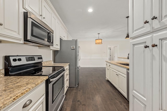 1165 Short Springs Rd, Tullahoma, TN 37388 - kitchen with appliances with stainless steel finishes, white cabinets, dark wood-style floors, and ornamental molding
