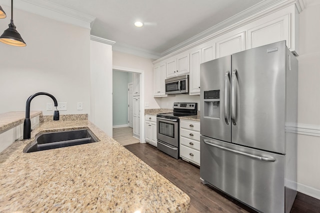 1165 Short Springs Rd, Tullahoma, TN 37388 - kitchen with appliances with stainless steel finishes, a sink, ornamental molding, white cabinets, and dark wood-style flooring