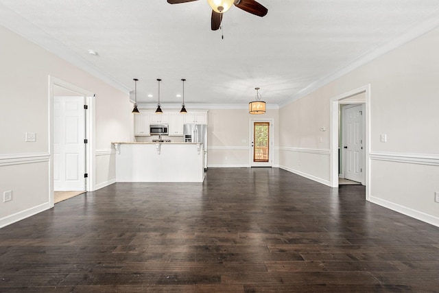 1165 Short Springs Rd, Tullahoma, TN 37388 - unfurnished living room featuring a ceiling fan, dark wood-type flooring, ornamental molding, and baseboards