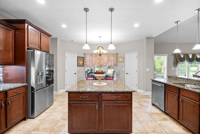 kitchen featuring appliances with stainless steel finishes, a sink, a chandelier, light tile patterned floors, and recessed lighting