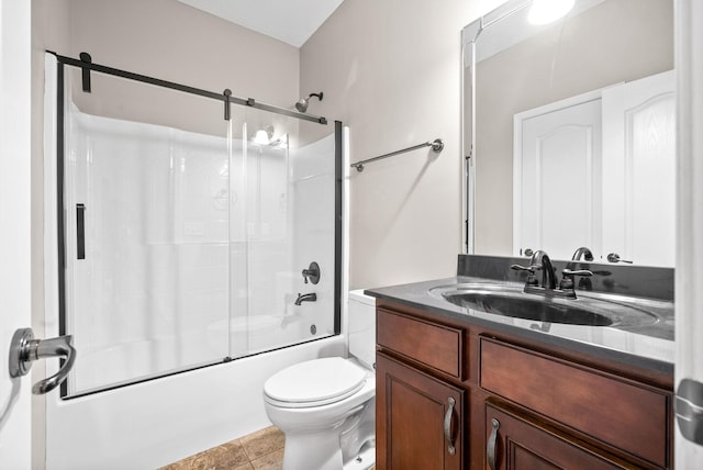 bathroom featuring toilet, vanity, and bath / shower combo with glass door