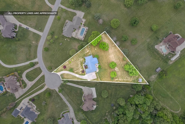 aerial view of property and surrounding area with property boundaries highlighted