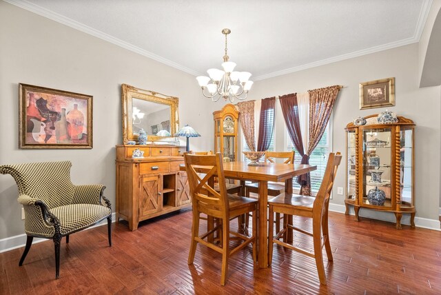 dining room featuring a chandelier, crown molding, dark wood-type flooring, and baseboards