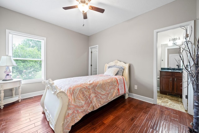 bedroom featuring baseboards, dark wood finished floors, multiple windows, and ceiling fan