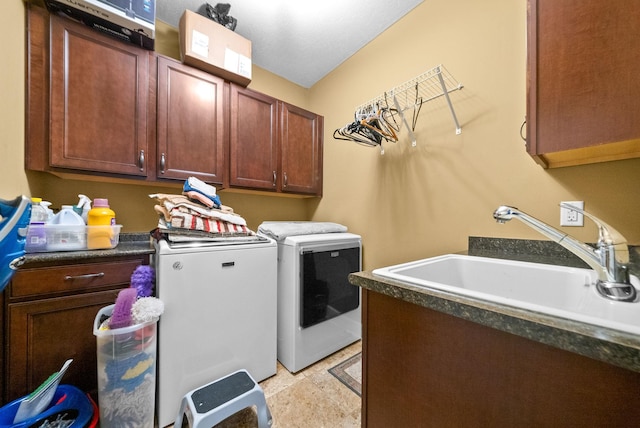 laundry room with washing machine and dryer and cabinet space