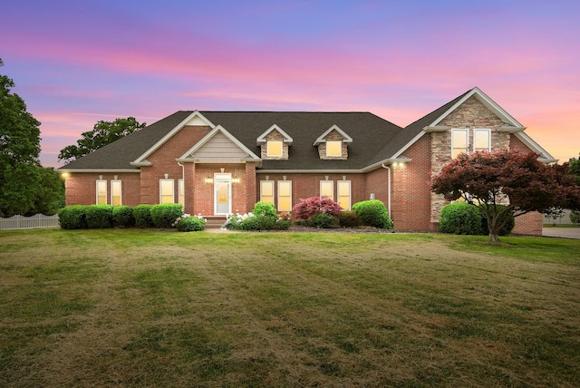 traditional-style house with brick siding and a shingled roof
