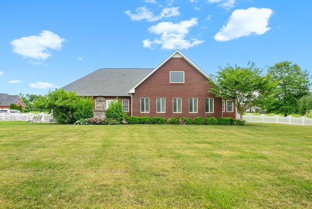 rear view of property featuring brick siding