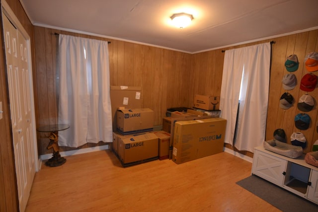800 E Grigsby St, Pulaski, TN 38478 - bedroom with light wood-type flooring, wood walls, and crown molding