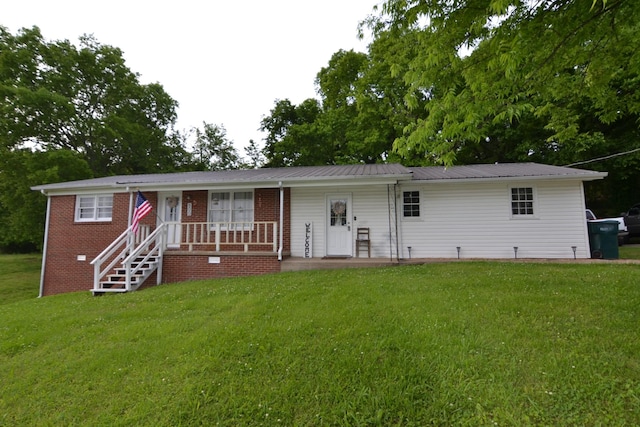 800 E Grigsby St, Pulaski, TN 38478 - single story home featuring a front lawn, covered porch, and metal roof