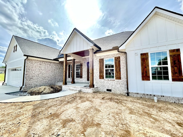 24 Hurst Dr, Leoma, TN 38468 - modern inspired farmhouse with board and batten siding, a garage, crawl space, brick siding, and a shingled roof