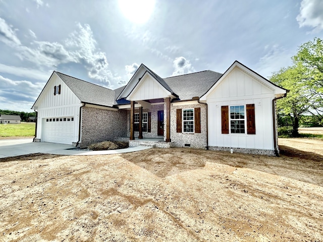 24 Hurst Dr, Leoma, TN 38468 - modern farmhouse featuring board and batten siding, a garage, and concrete driveway