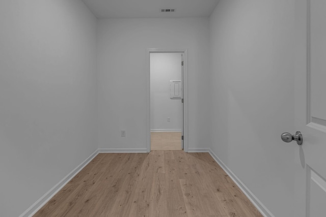 unfurnished room with light wood-style floors and baseboards