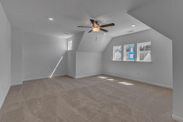 bonus room featuring a ceiling fan, recessed lighting, healthy amount of natural light, baseboards, and lofted ceiling